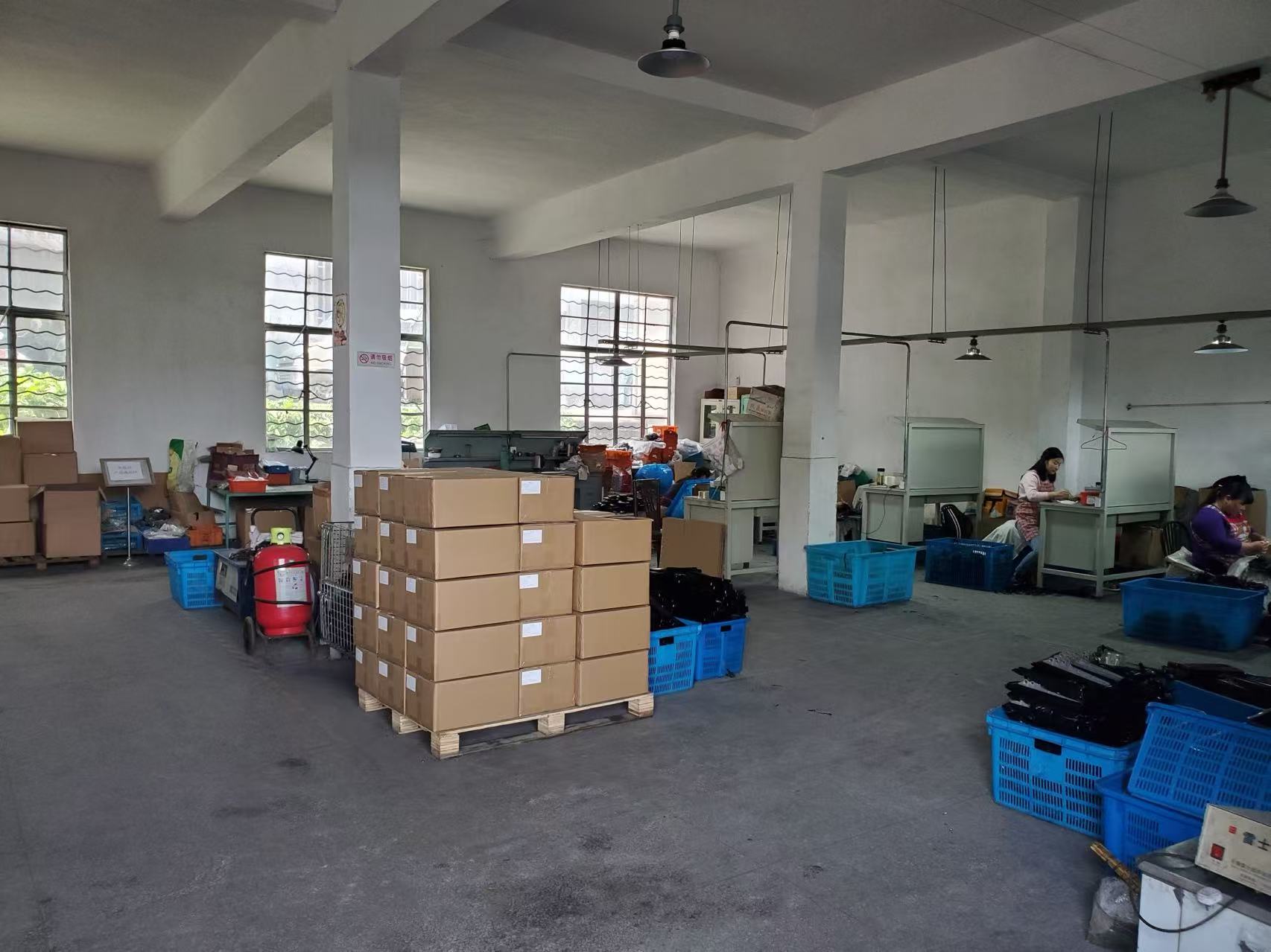 Staff working beside finished components and packing materials