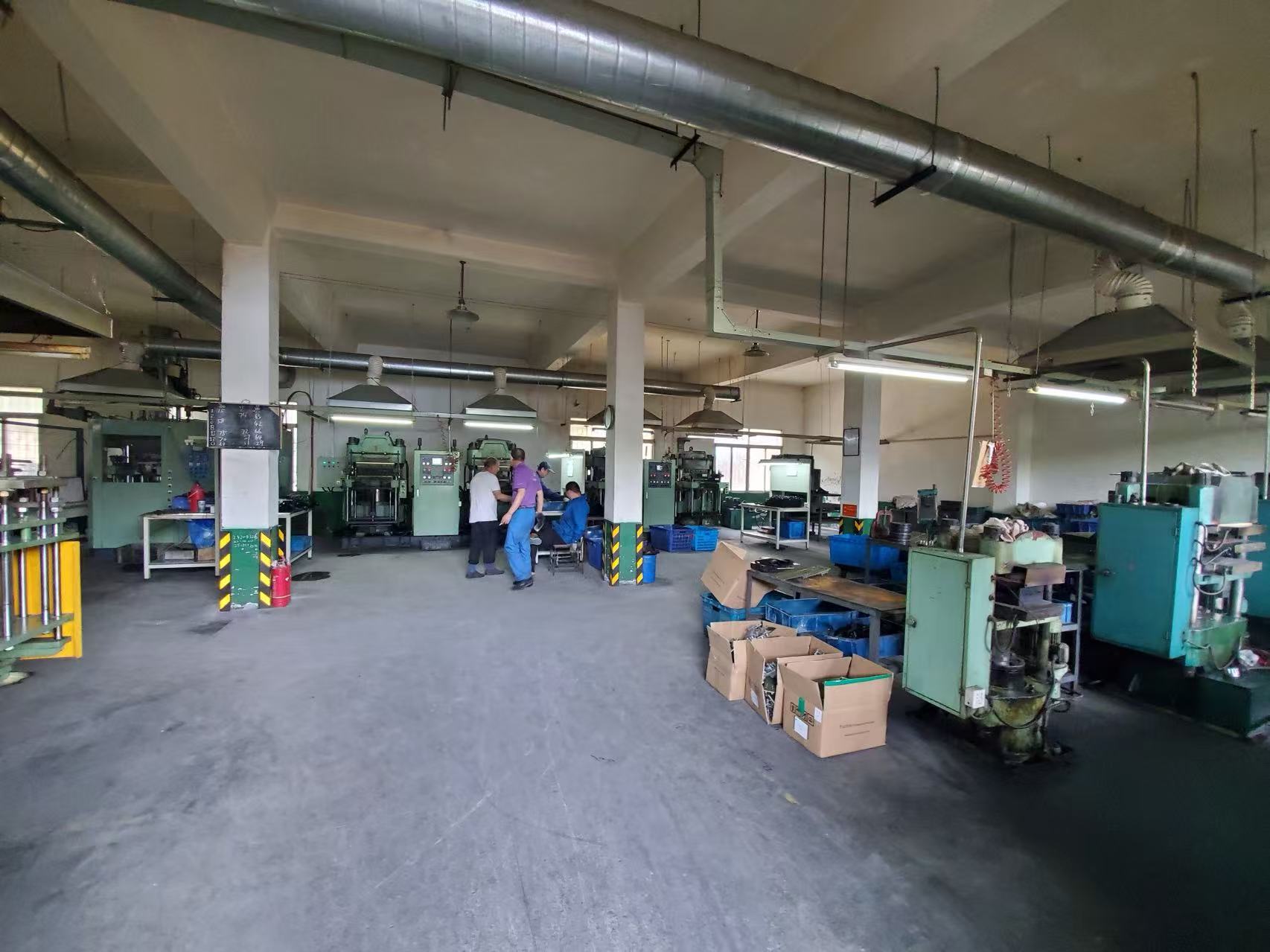 Labei Rubber production floor with machinery and staff